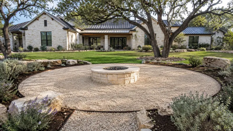Custom stone fire pit in Spring Branch, TX by CJK Landscaping – project photo 1