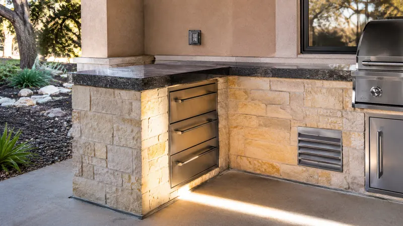 Outdoor kitchen and grill island in Spring Branch, TX by CJK Landscaping – project photo 7