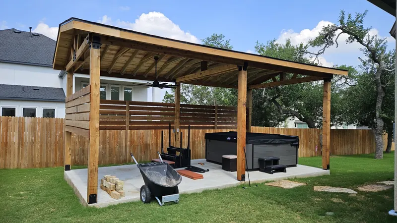 Custom covered patio with hot tub in Spring Branch, TX by CJK Landscaping