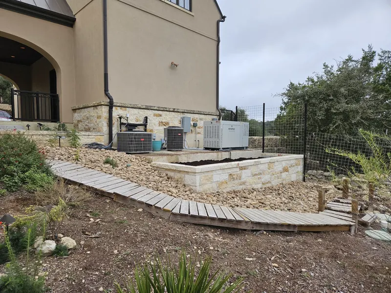 Retaining wall and timber walkway on a slope in Spring Branch, TX by CJK Landscaping