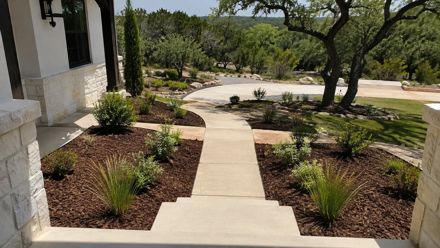 Spring mulching experts from CJK Landscaping spreading bed cover in Spring Branch, TX